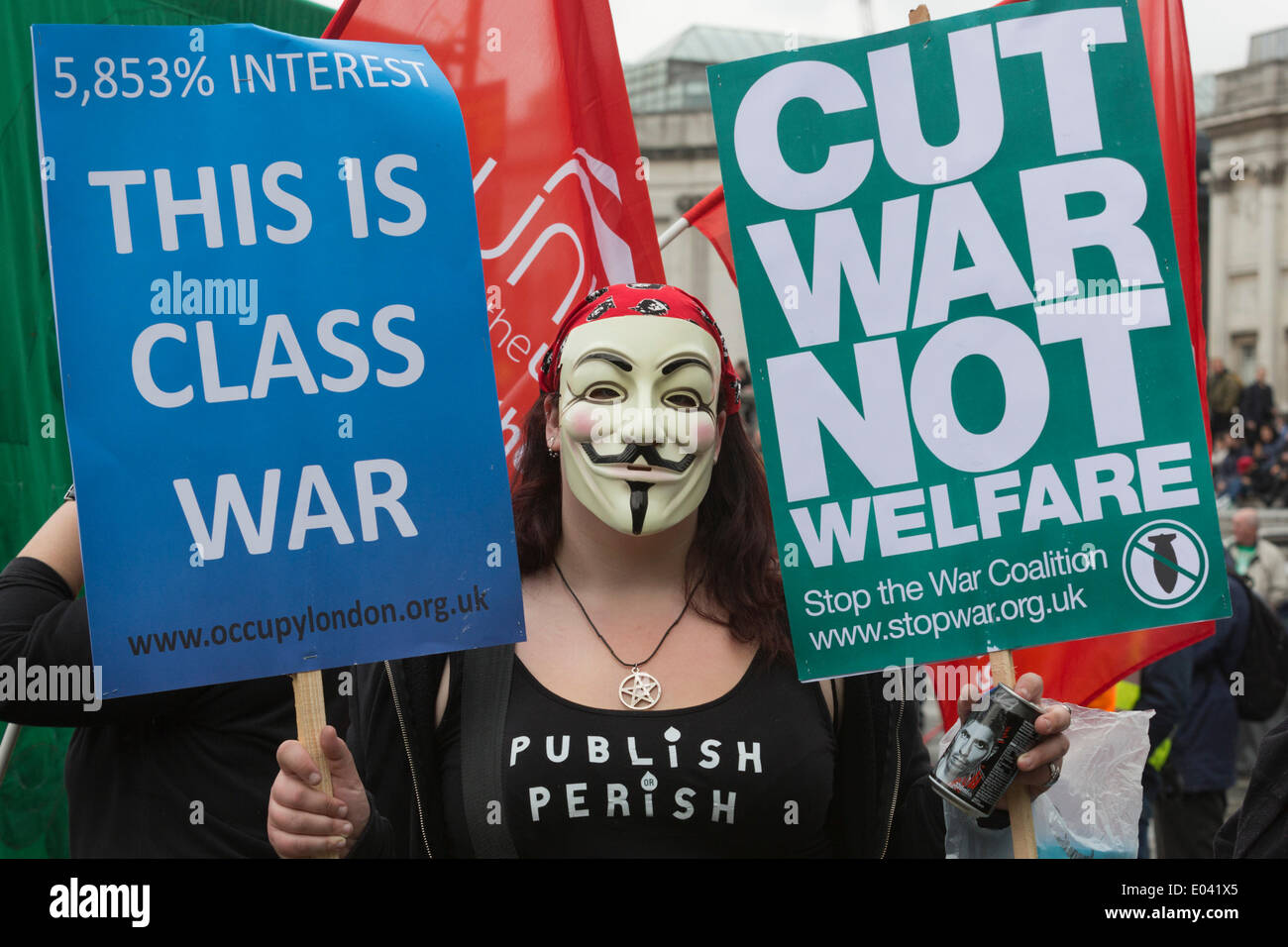 London, UK. 1 May 2014. Pictured: Woman wearing a V for Vendetta mask protests against Wonga pay day loan company and loan sharks. May Day Trade Union Rally in Trafalgar Square, London, UK. At this Rally the recently deceased Bob Crow, RMT General Secretary,  and Tony Benn, Labour politician were honoured. Credit:  Nick Savage/Alamy Live News Stock Photo