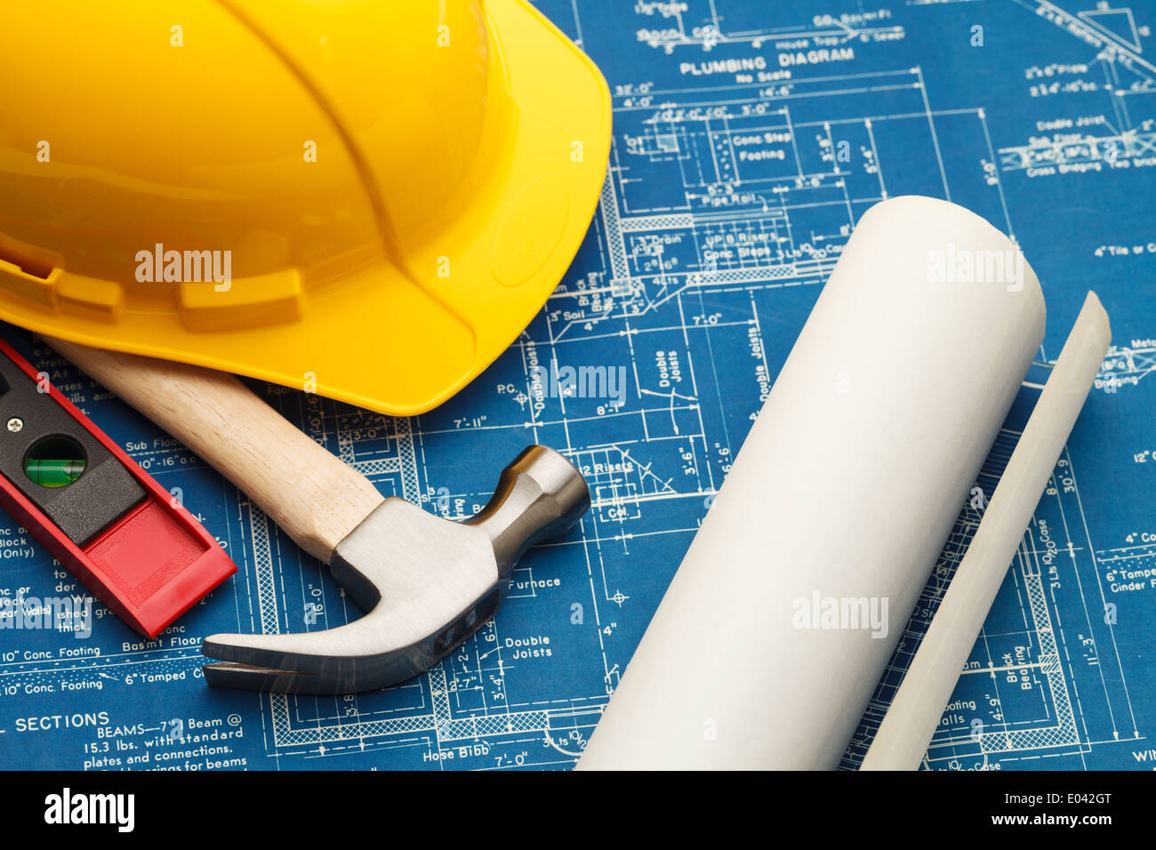Blueprints and Construction Tools with Hard Hat. Stock Photo