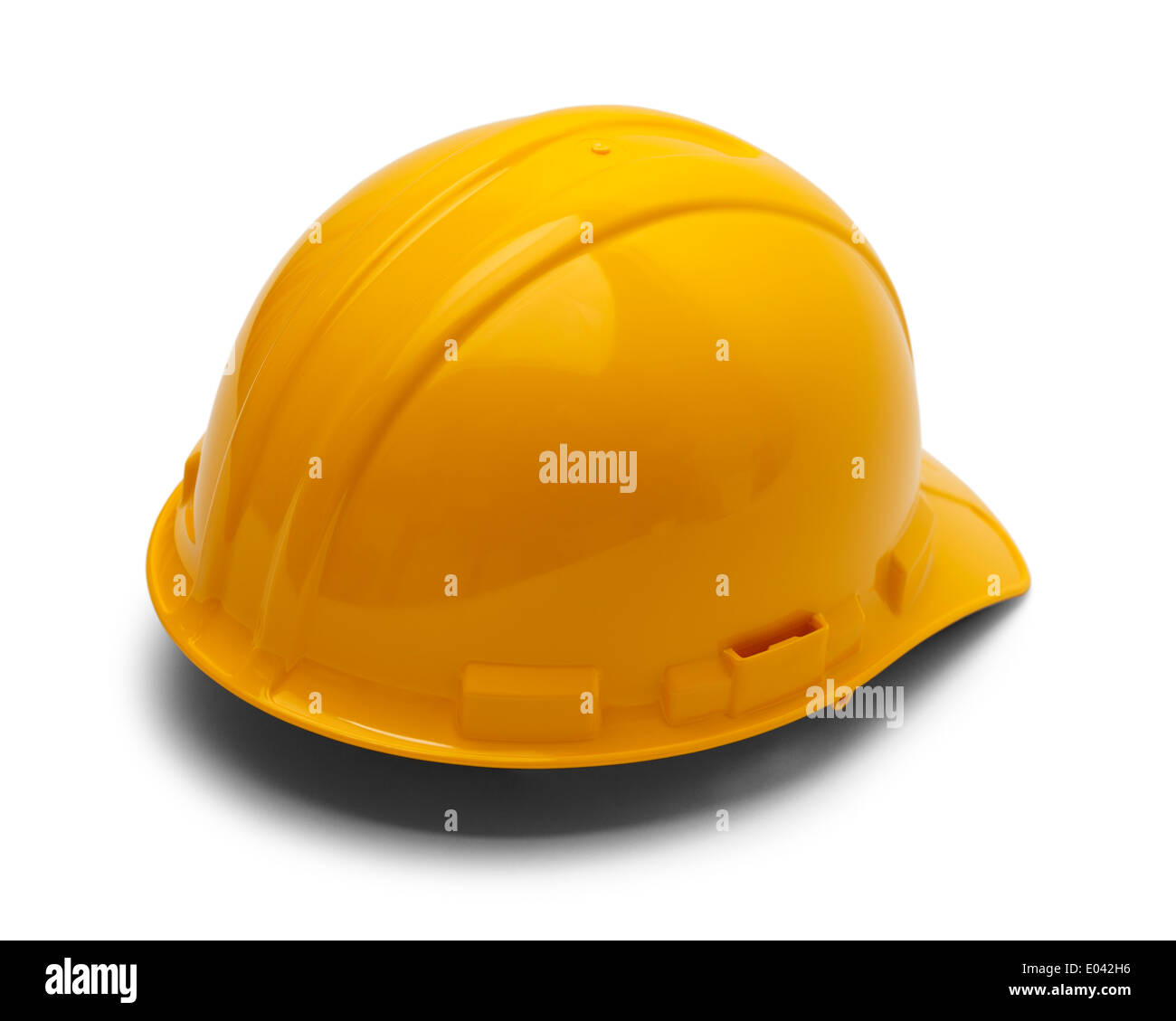 Yellow Plastic Helmet Isolated on White Background. Stock Photo