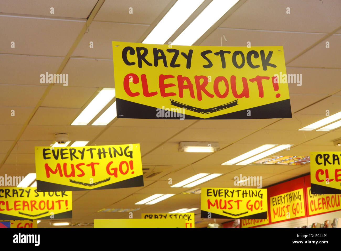 Sale signs hanging from shop suspended ceiling Stock Photo
