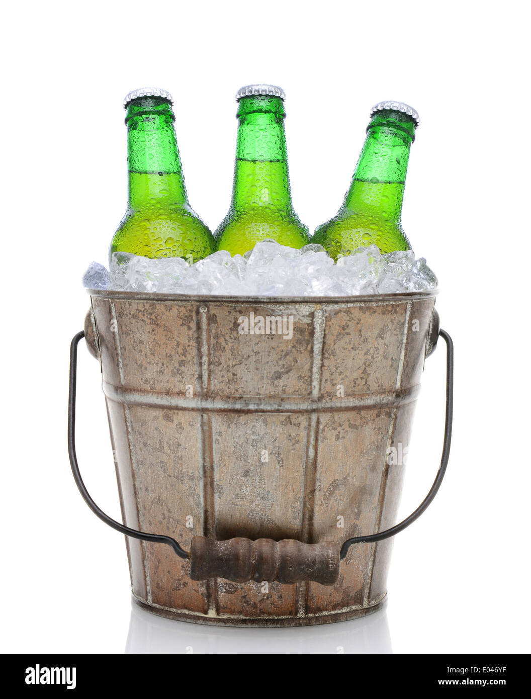 Closeup of an old fashioned beer bucket with three green bottles of