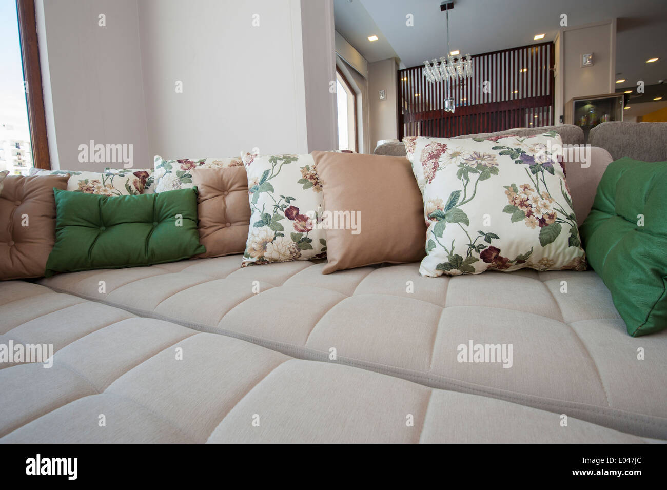 Large sofa closeup detail with cushions on display in furniture