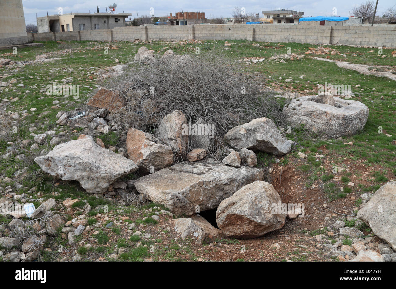 Stones cover an Armenian underground cave burial in the village of Cibin, Saylakkaya, Urfa province, south east Turkey Stock Photo
