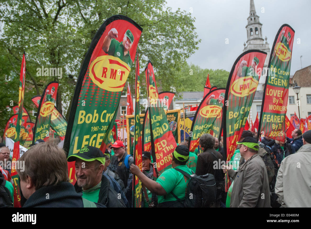 London, UK. 01st May, 2014. Supporters hold flags during the May Day march honoring Bob Crow who led the RMT union before he passed away in March 2014. London, UK. Credit:  Peter Manning/Alamy Live News Stock Photo