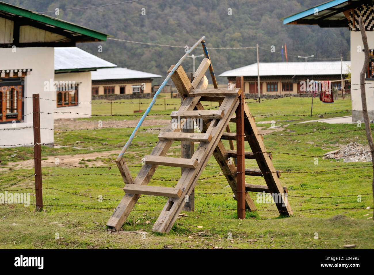 Ladder over fence hires stock photography and images Alamy