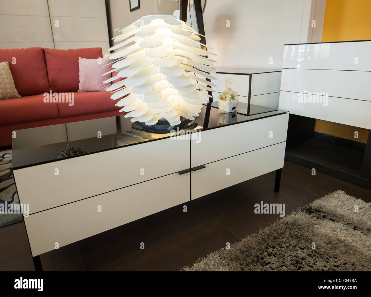 Table and drawer unit on display in living room show home Stock Photo