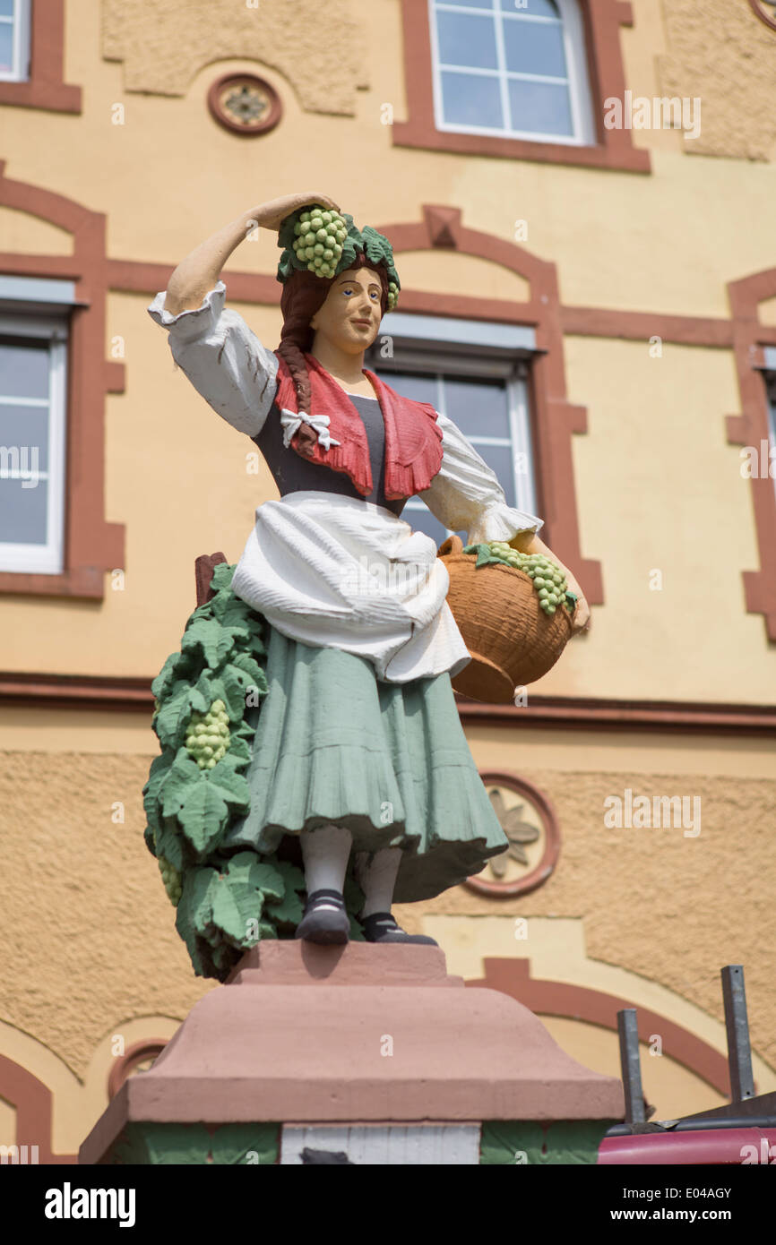 Statue of a woman collecting grapes for wine at Traben-Trarbach, a city along the Mosel in Germany Stock Photo