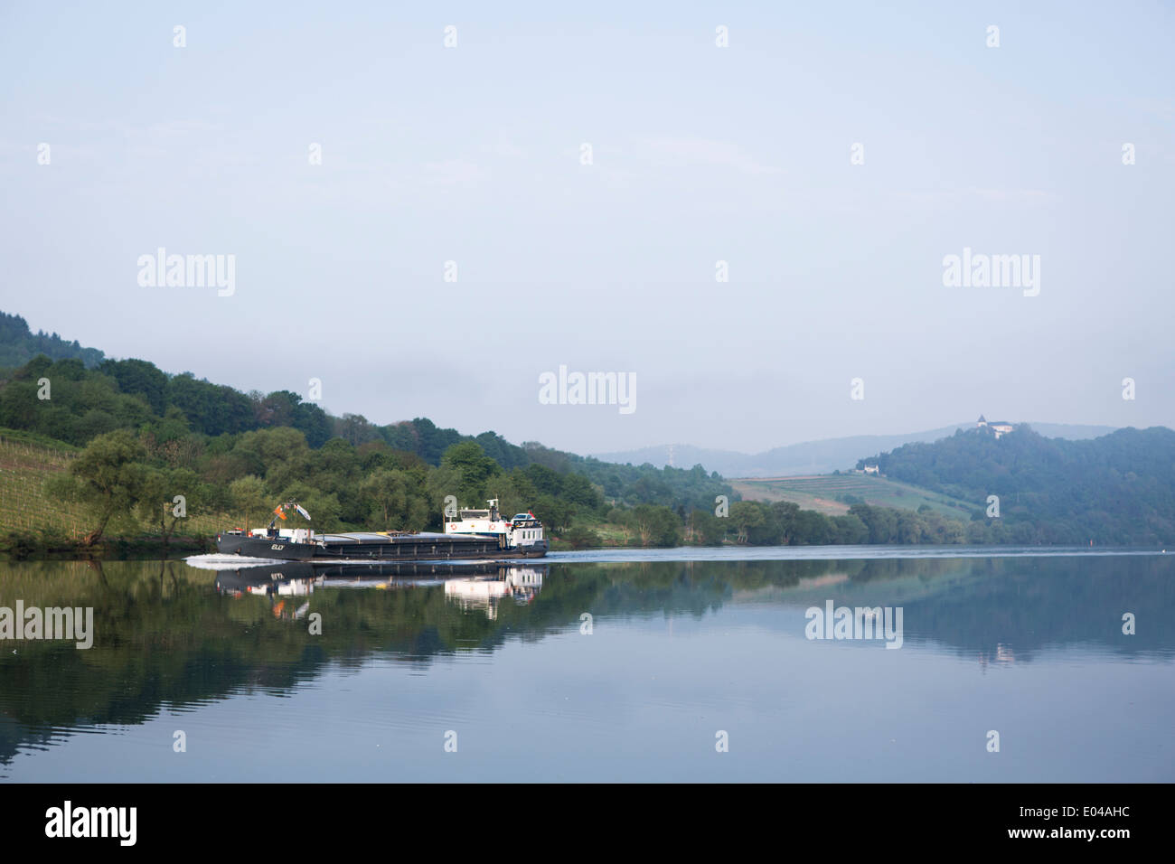 Dutch barge on the river Mosel passing Zell Merl in the early morning, Germany, Europe Stock Photo