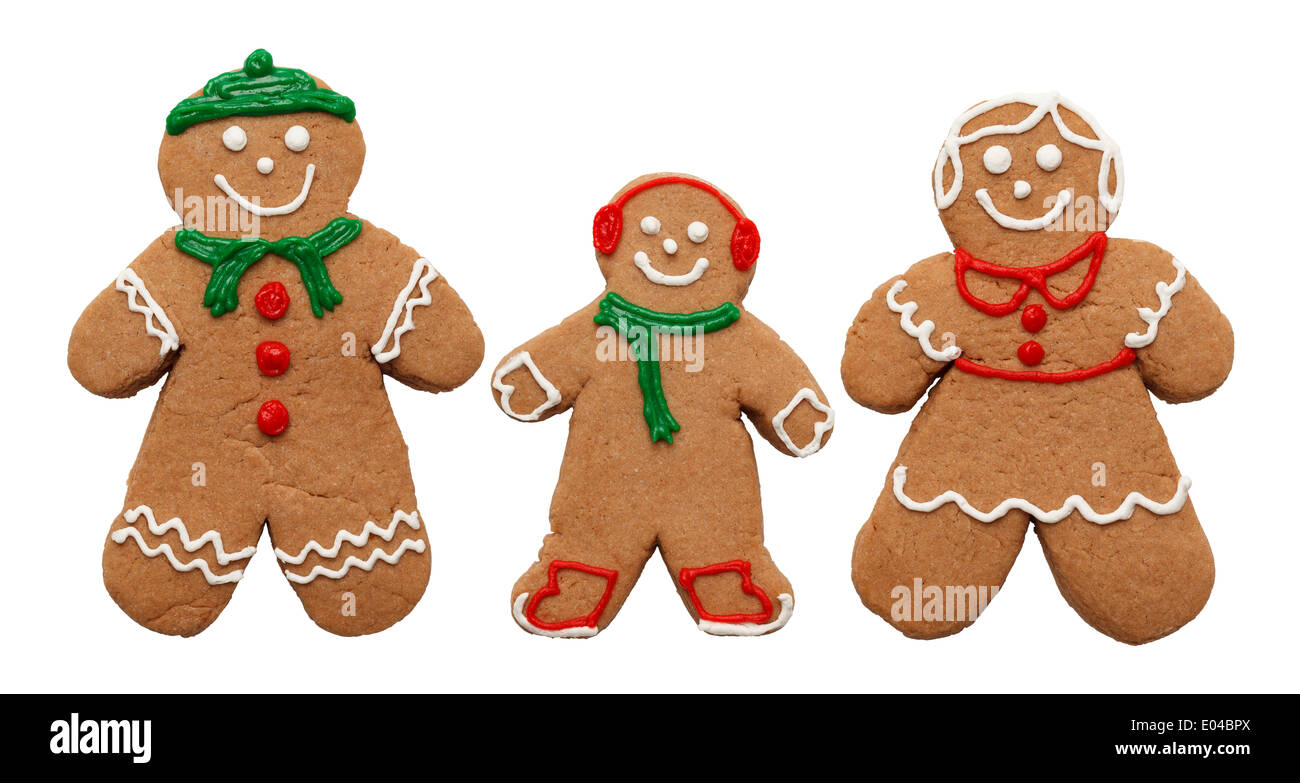 Three Gingerbread Cookies Man Woman and Child Isolated on White Background. Stock Photo