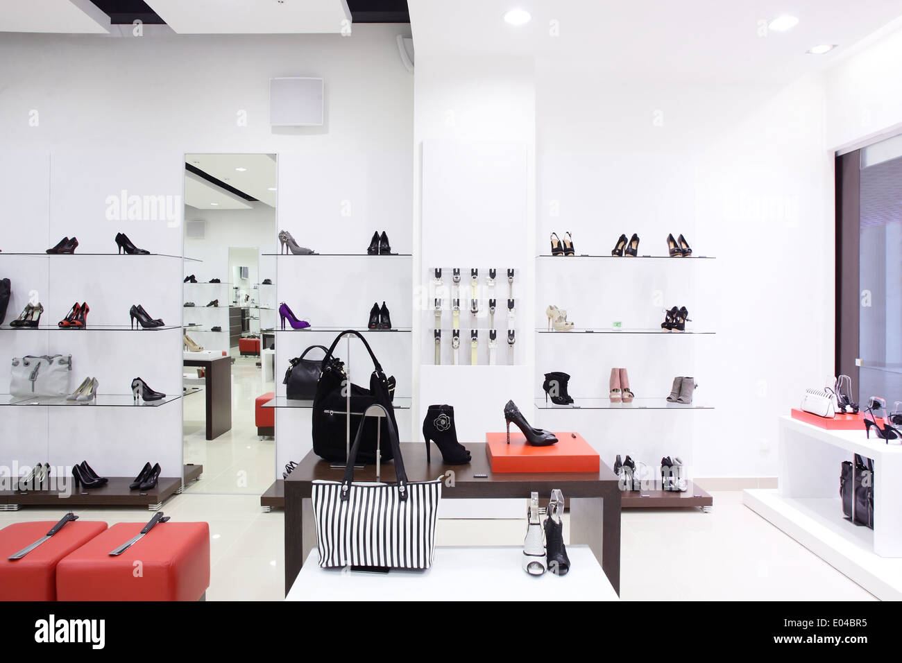 clean and bright luxury european shoes store Stock Photo Alamy