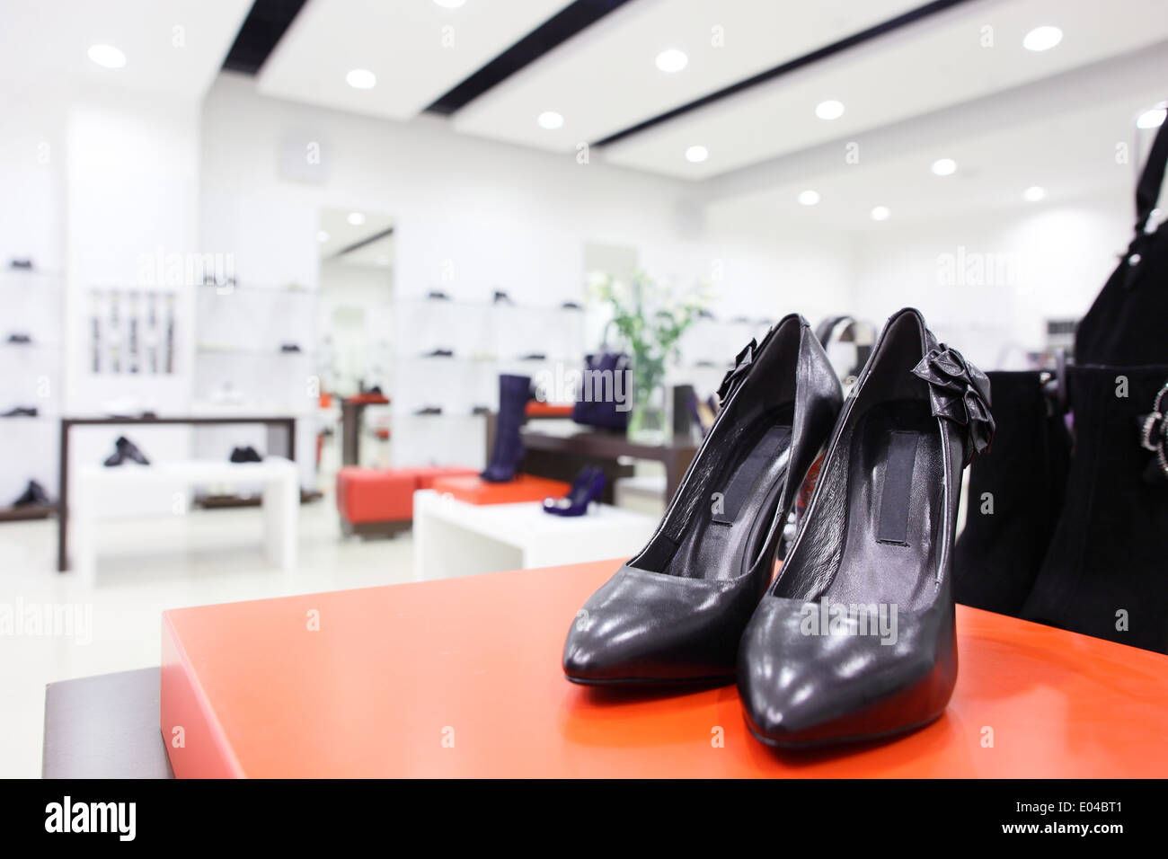 clean and bright luxury european shoes store Stock Photo Alamy