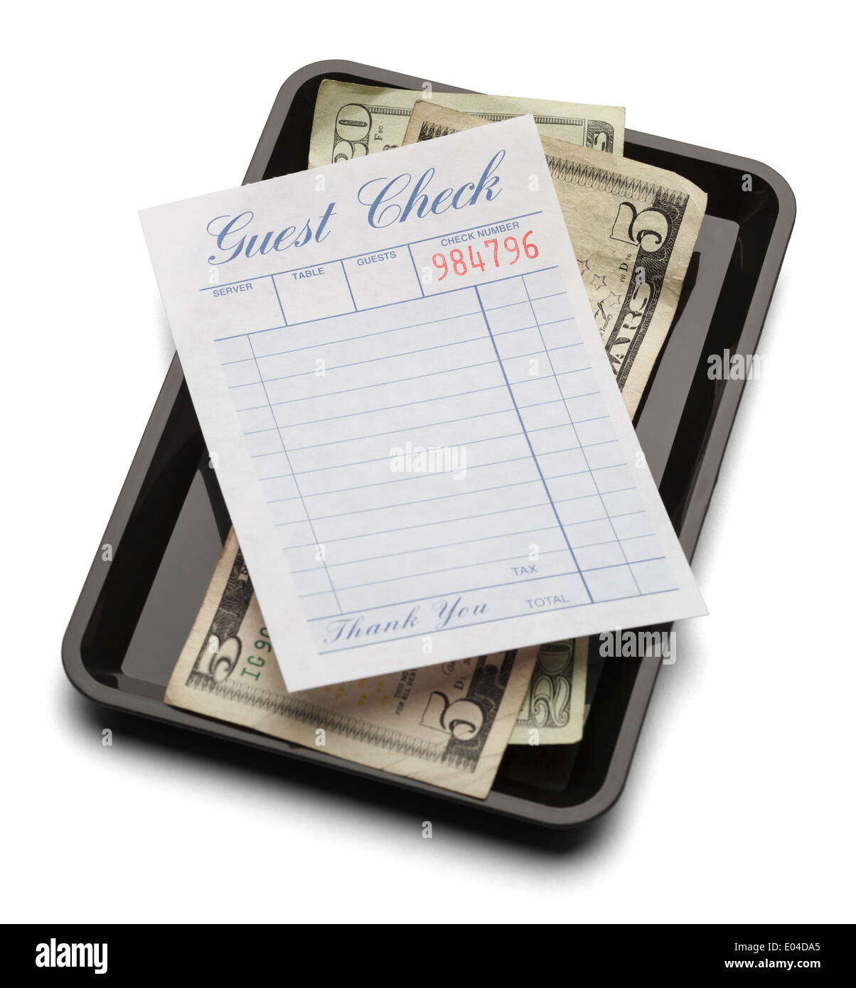 Resturant bill with money on payment tray isolated on a white background. Stock Photo
