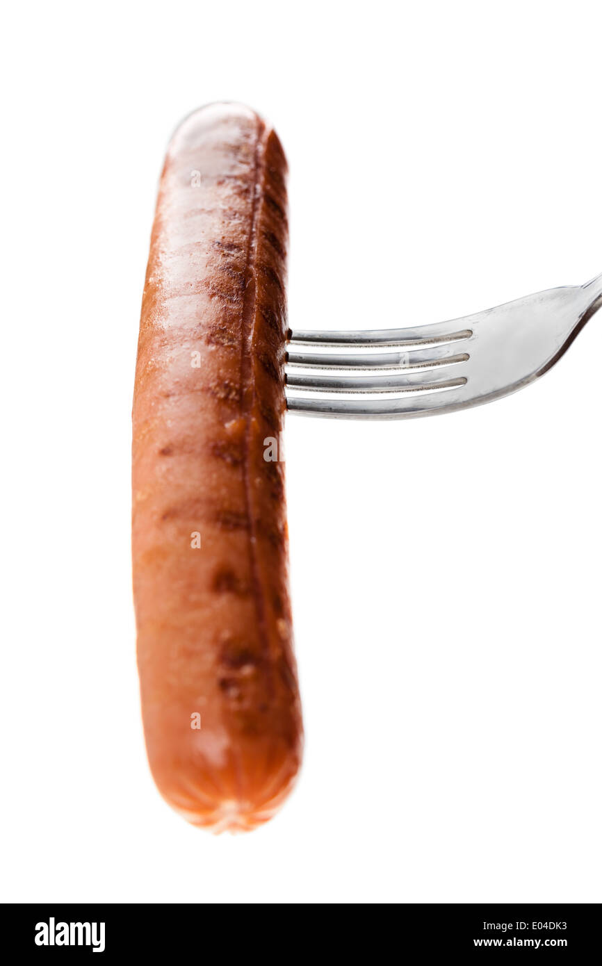 a delicious sausage on a fork over white Stock Photo