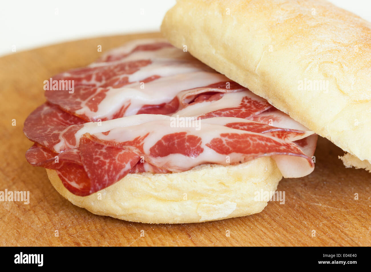 a delicious sandwich filled with italian salami (coppa di parma Stock