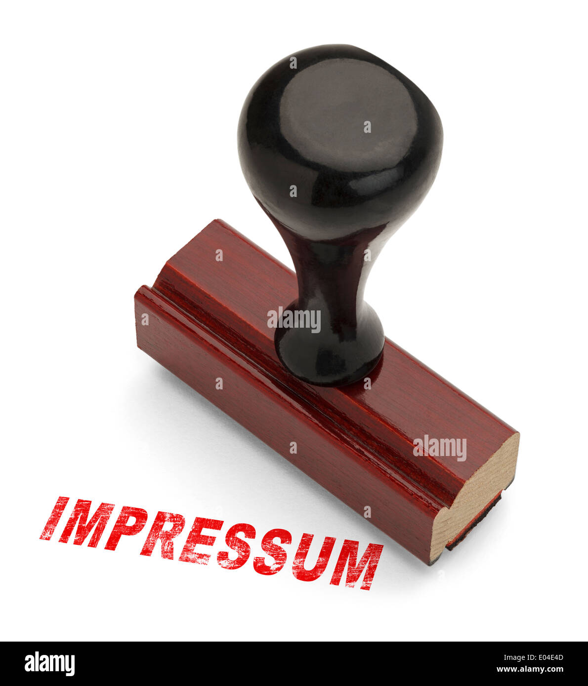 Wooden Stamper with the word Impressum Stamped in Red Ink. Isolated on White Background. Stock Photo