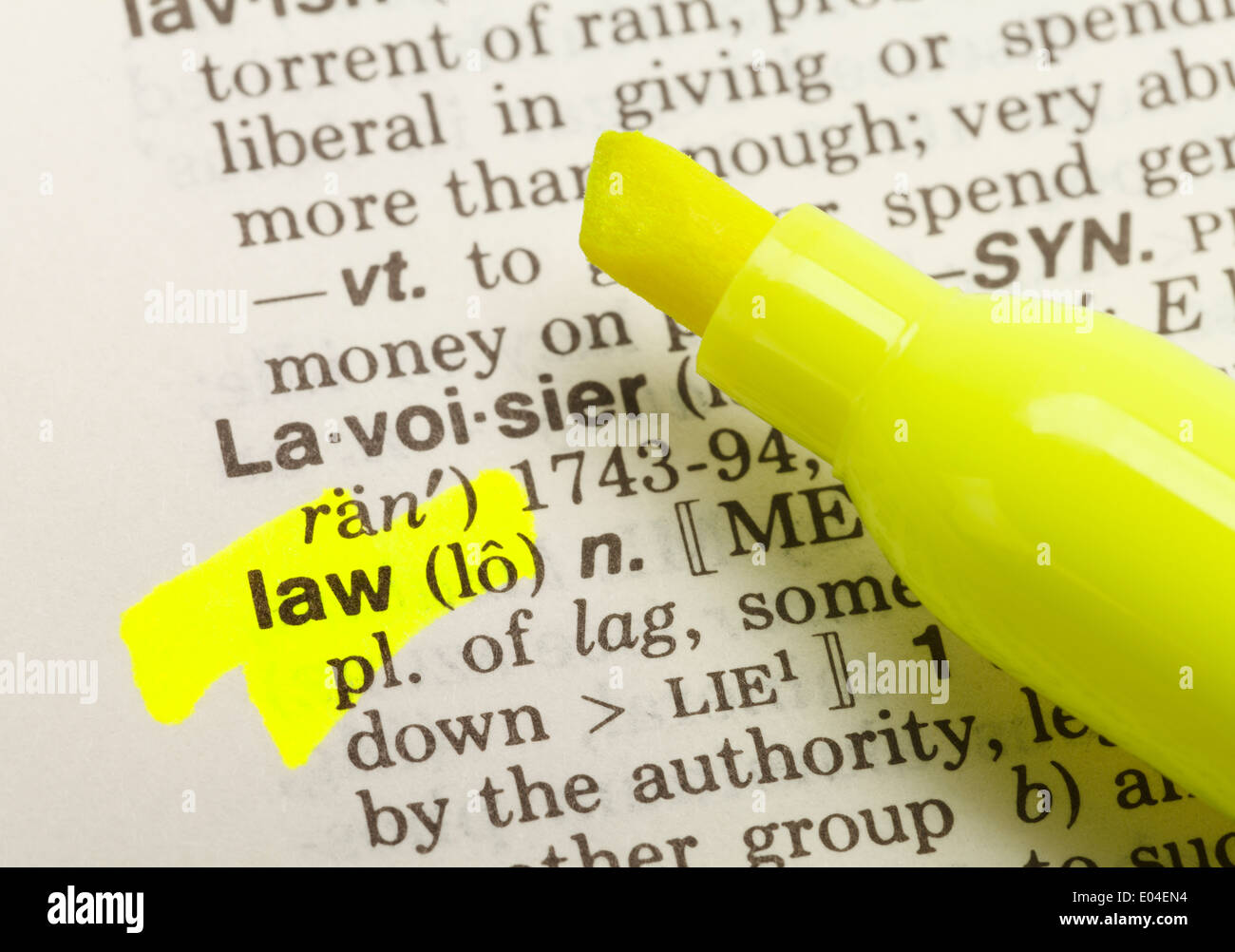 The Word Law Highlighted in Dictionary with Yellow Marker Highlighter Pen. Stock Photo