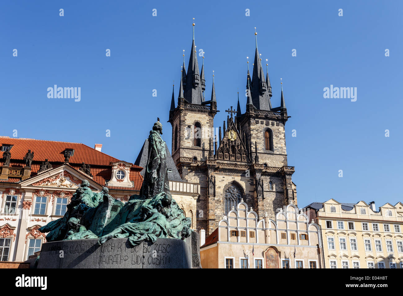 Statue of jan Hus behind Church of the Mother of God Stock Photo