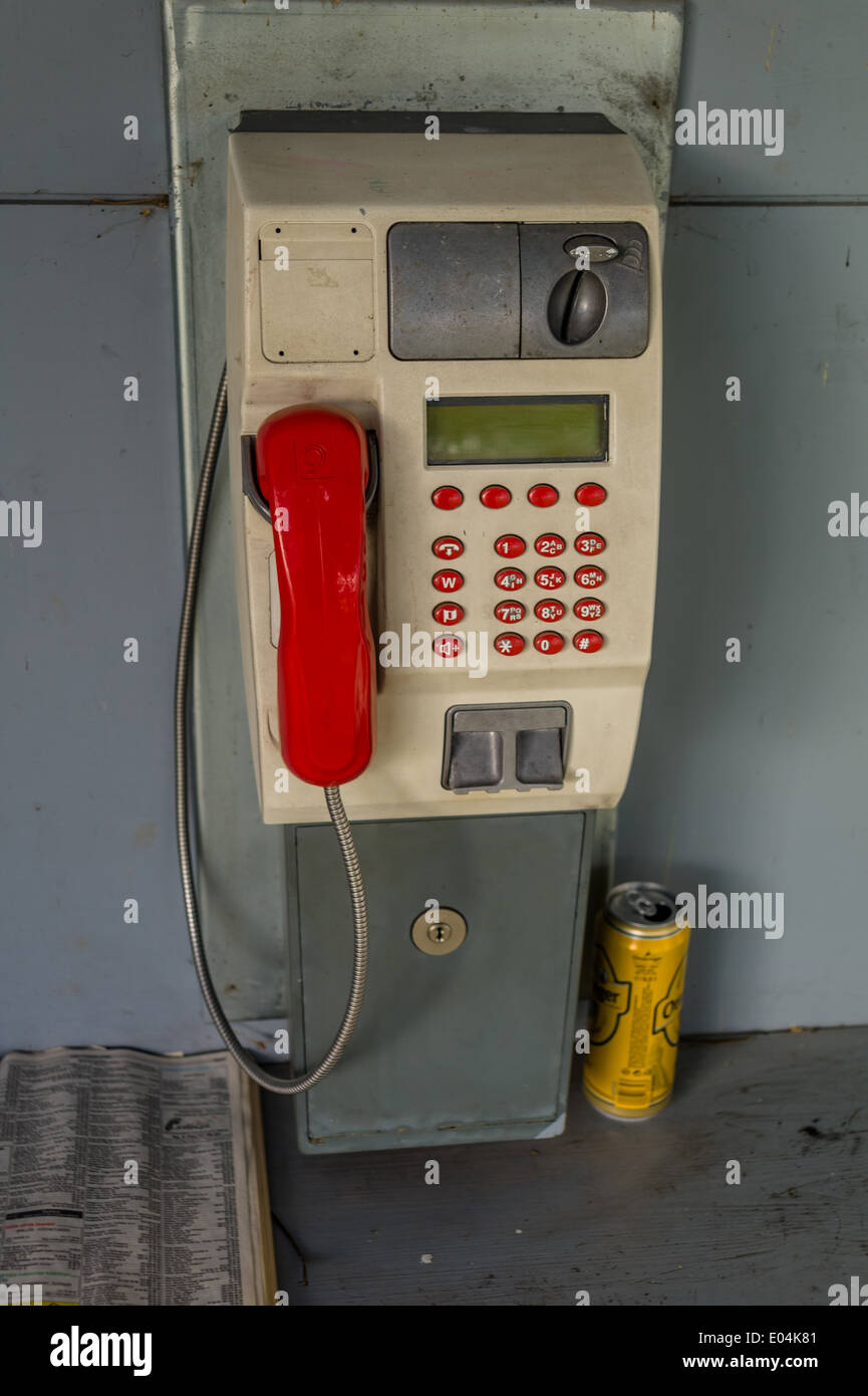 A pay phone box in a telephones. Phoning ace earlier with money and coins, Ein Muenzfernsprecher in einer Telefonzelle. Telefoni Stock Photo