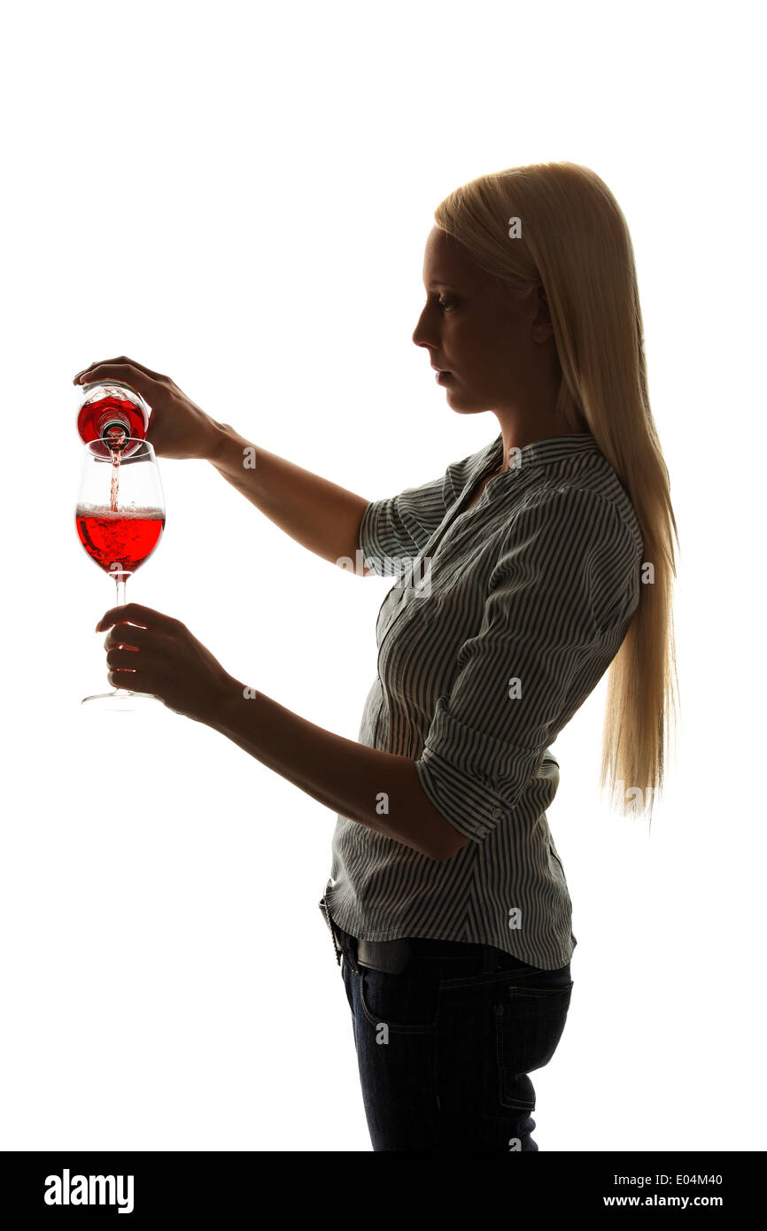 Young woman with a glass of red wine with Weinverkostung, Junge Frau mit einem Glas Rotwein bei Weinverkostung Stock Photo