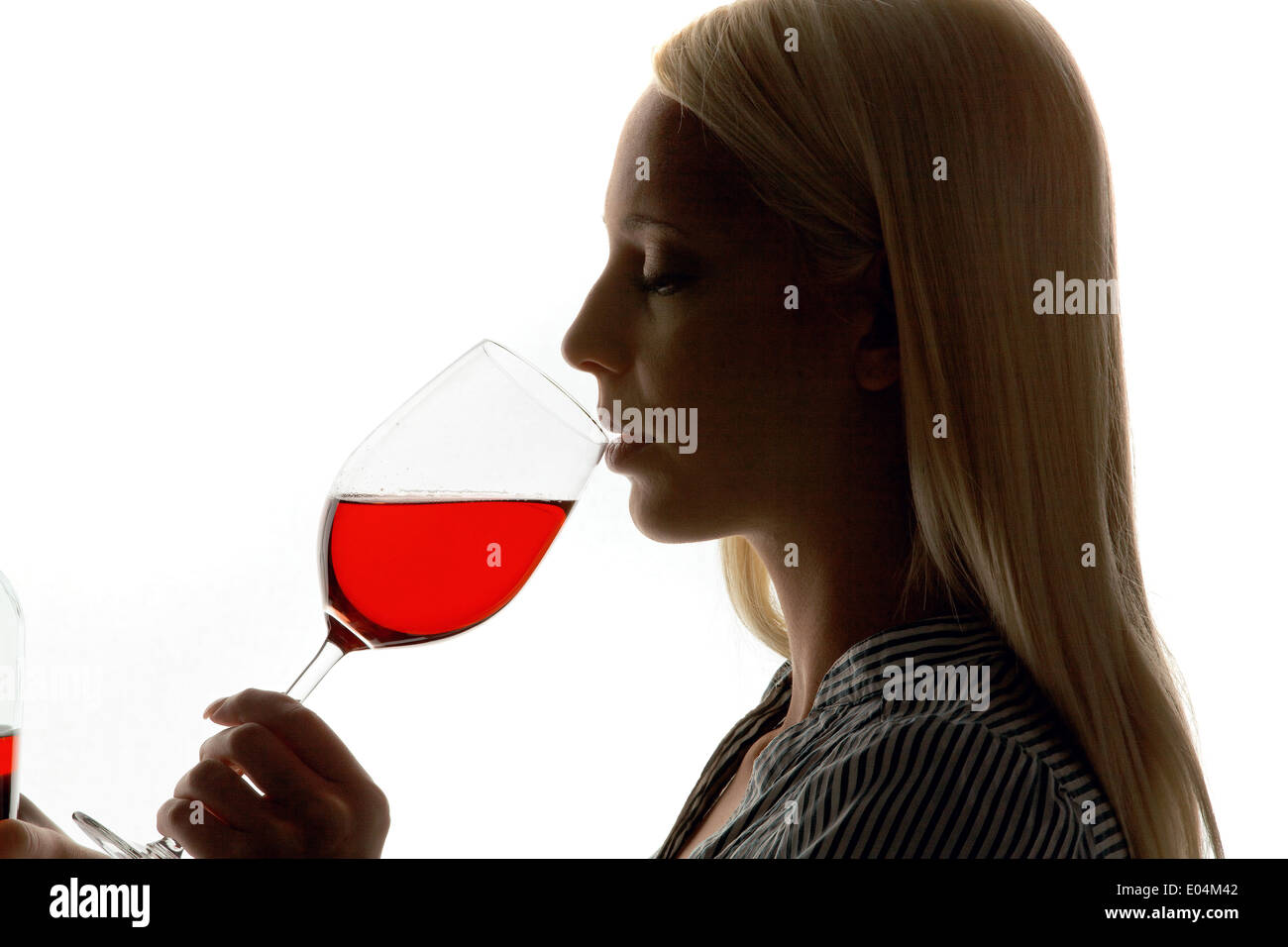 Young woman with a glass of red wine with Weinverkostung, Junge Frau mit einem Glas Rotwein bei Weinverkostung Stock Photo