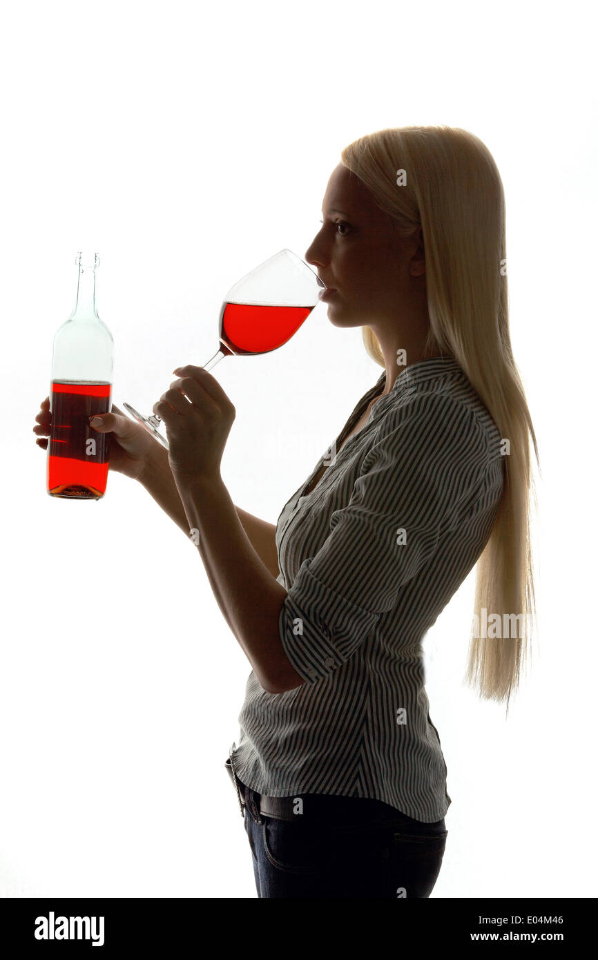 Young woman with a glass of red wine with Weinverkostung, Junge Frau mit einem Glas Rotwein bei Weinverkostung Stock Photo