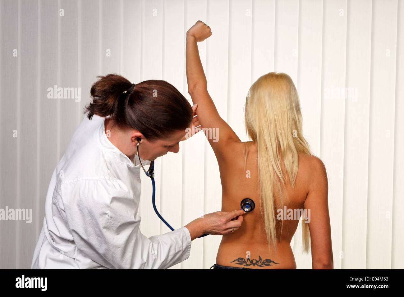Young girl with a medical investigation, Junges Maedchen bei einer aerztlichen Untersuchung Stock Photo