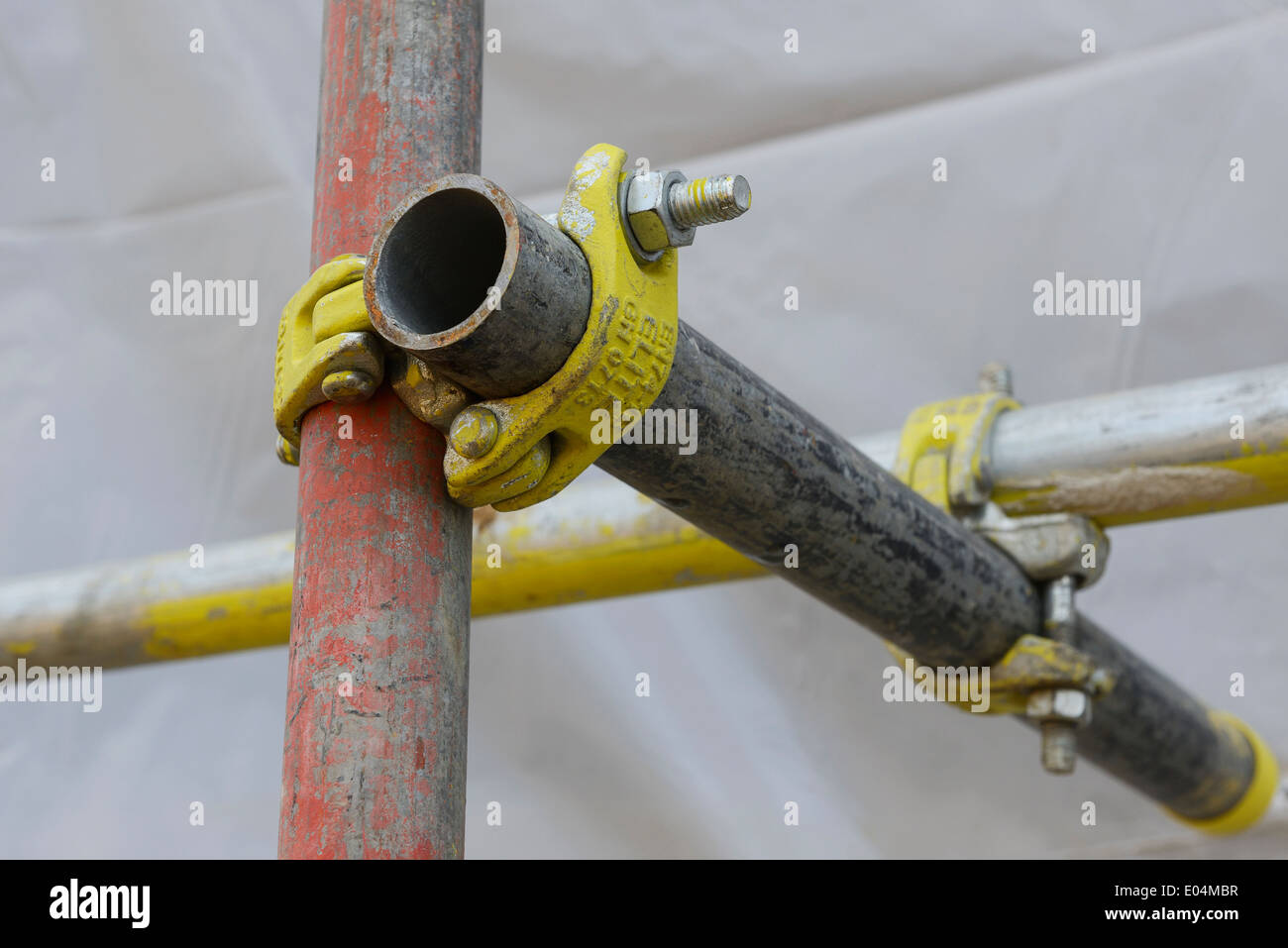 Scaffold poles connected together on a UK construction site Stock Photo
