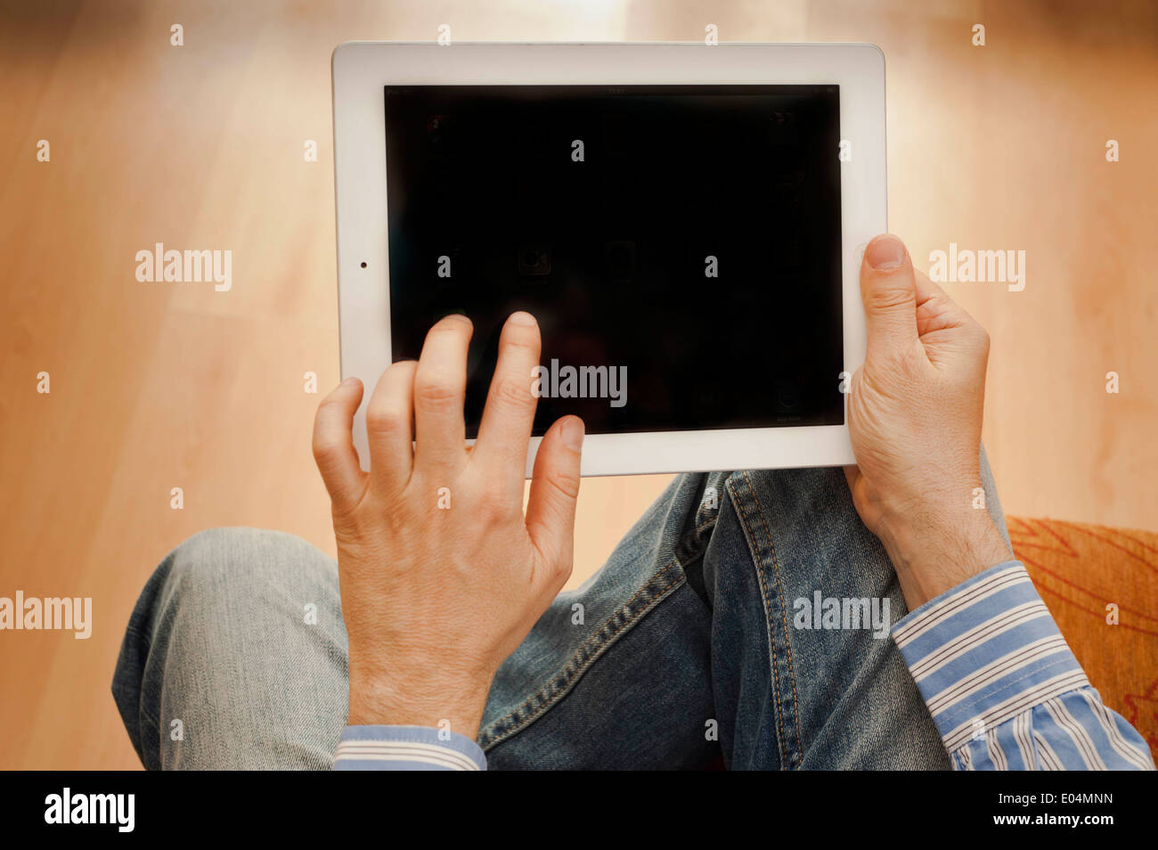 man hands holding and using a tablet computer, blank screen Stock Photo