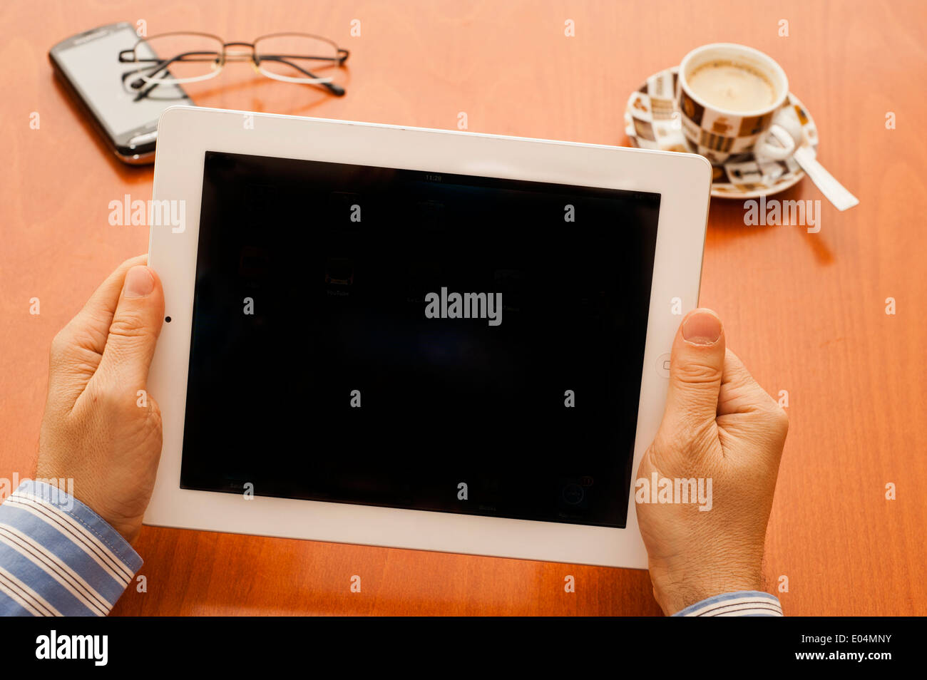 man hands holding tablet computer, blank screen Stock Photo