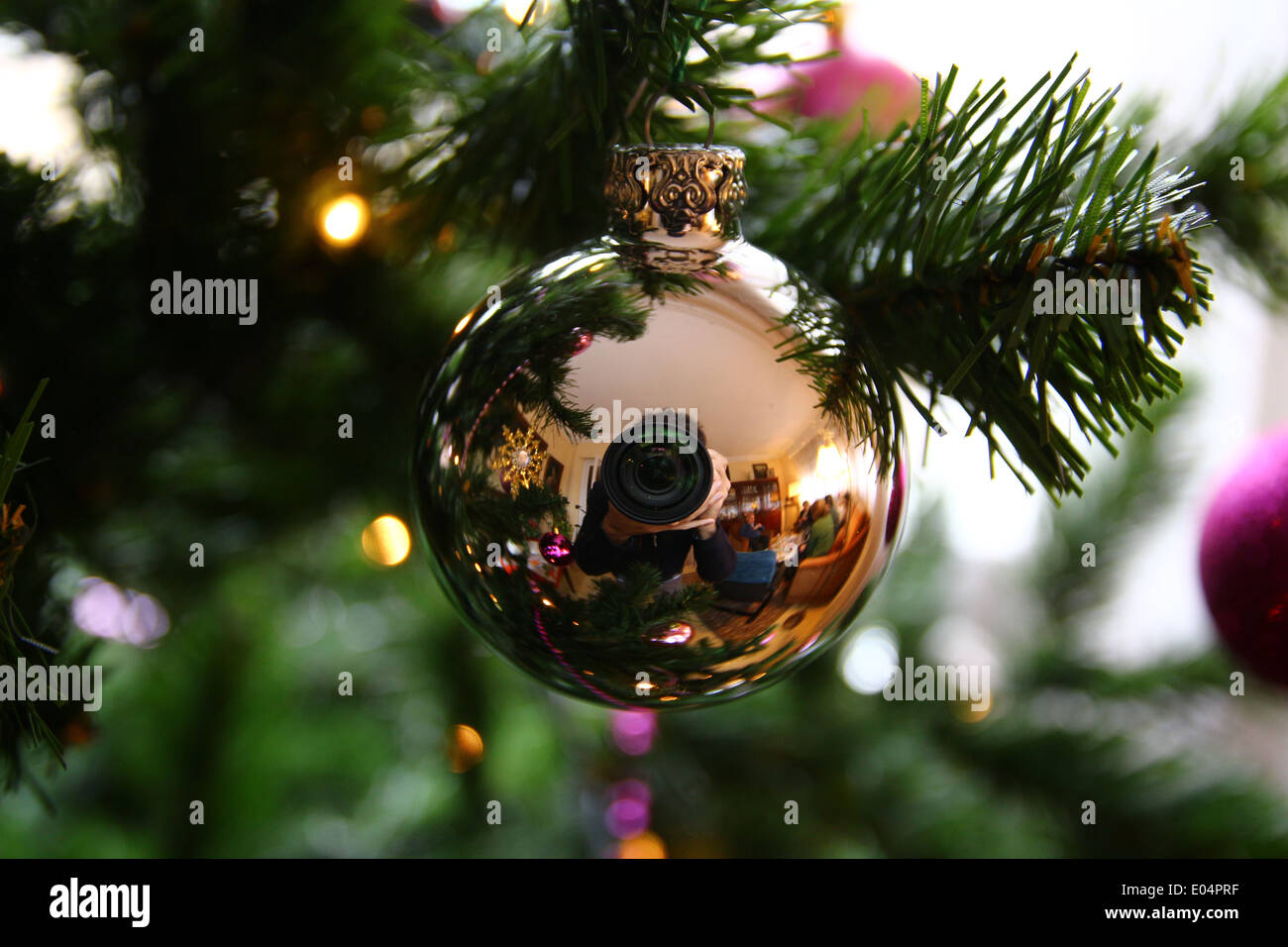 A Christmas ornament reflecting the photographer inside Stock Photo - Alamy