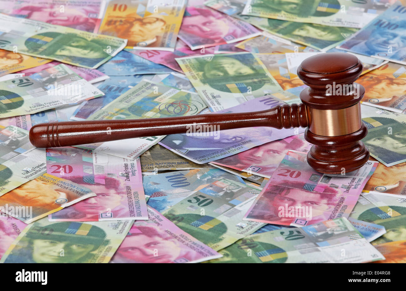 Money Swiss franc and a judge hammer, Geld Schweizer Franken und ein Richter Hammer Stock Photo