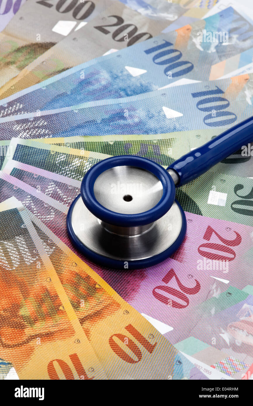 .Swiss francs and Stethoskop, symbol health costs, Schweizer Franken und Stethoskop, Symbol Gesundheitskosten Stock Photo