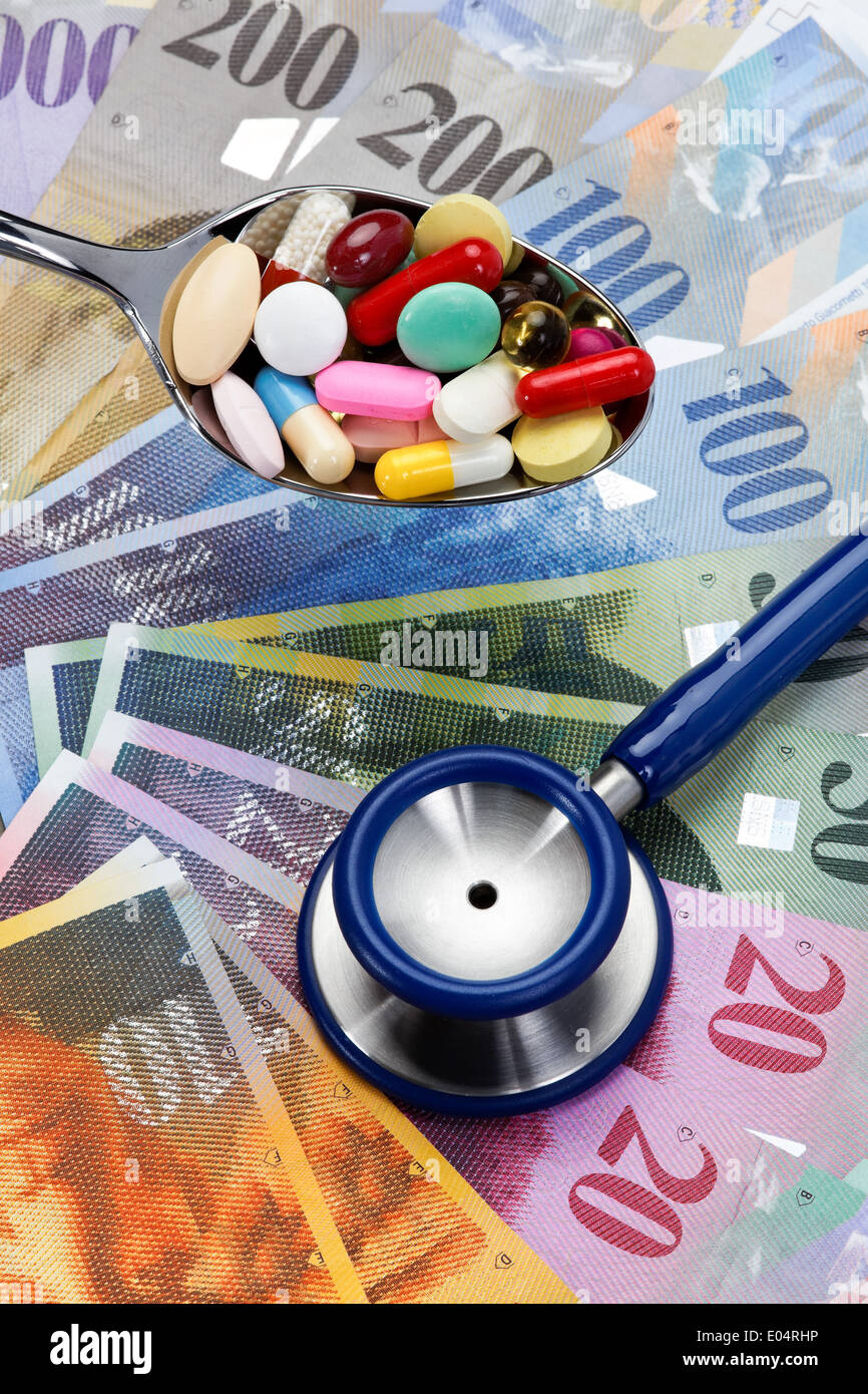 Swiss francs and Stethoskop, symbol health costs, Schweizer Franken und Stethoskop, Symbol Gesundheitskosten Stock Photo