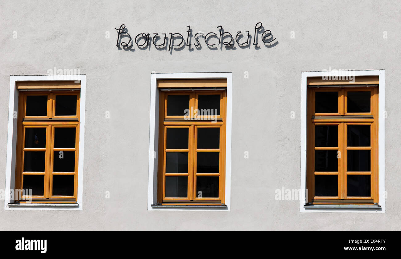 Facade with window fronts with the stroke secondary moulder school in metal, Fassade mit Fensterfronten mit dem Schriftzug Haupt Stock Photo