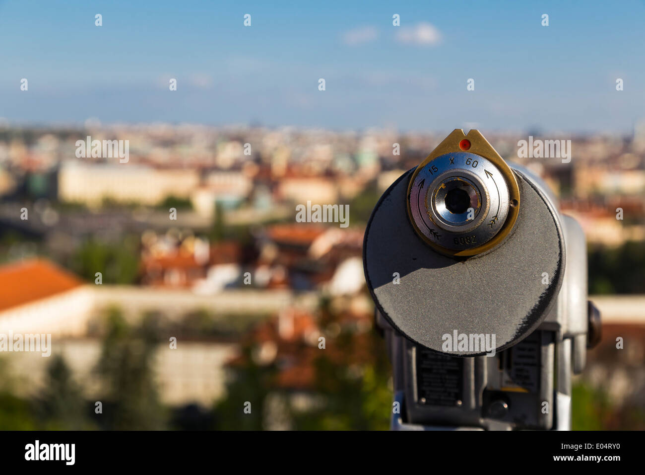 Old coin binoculars over the Prague city Stock Photo