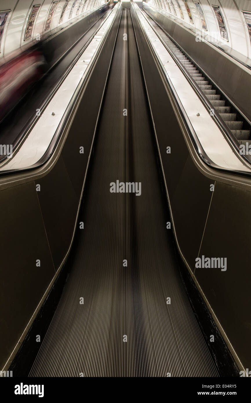 Underground escalator in motion Stock Photo