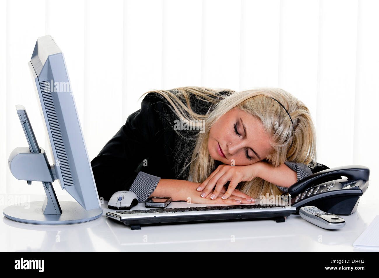Young woman with of problem and put under stress in the office, Junge Frau mit Problemen und Stress im Buero Stock Photo
