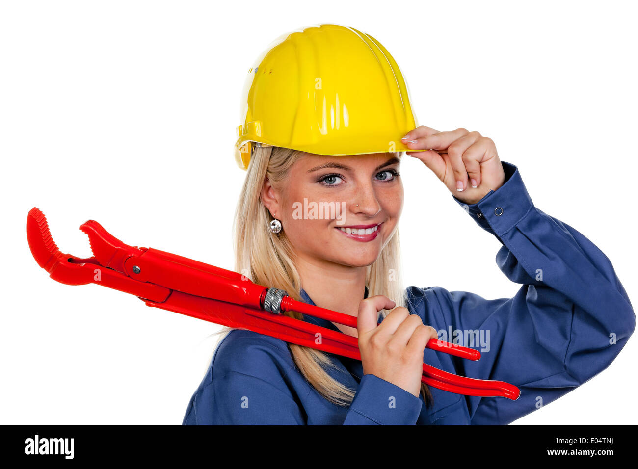 Young woman in blue Arbeits clothes with gaspipe pliers., Junge Frau in blauer Arbeits Kleidung mit Rohrzange. Stock Photo