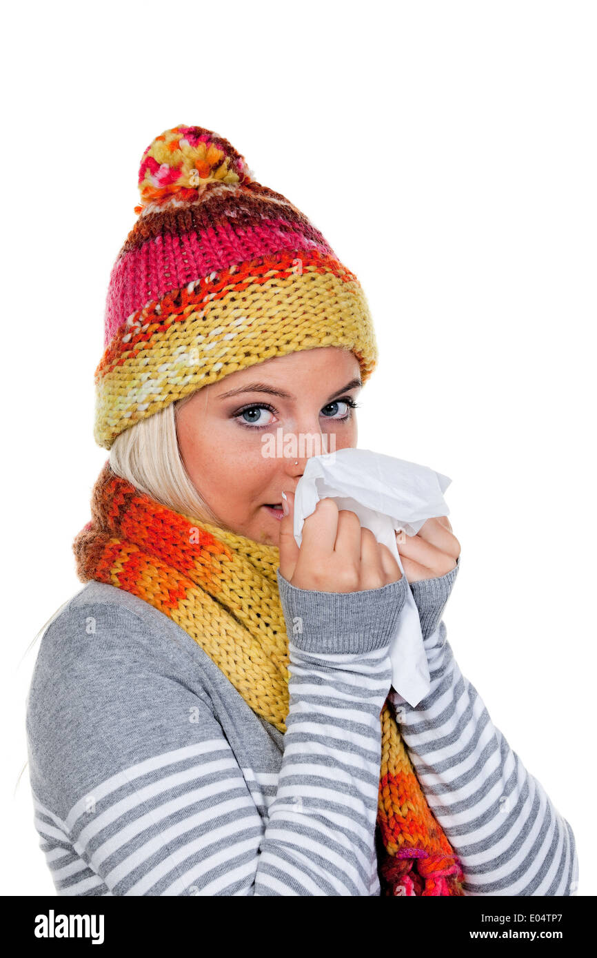 Young woman with a cold and cold., Junge Frau mit Schnupfen und Erkaeltung. Stock Photo