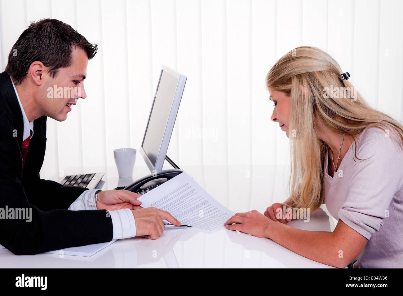 One and woman with a consultation, Mann und Frau bei einem Beratungsgespraech Stock Photo