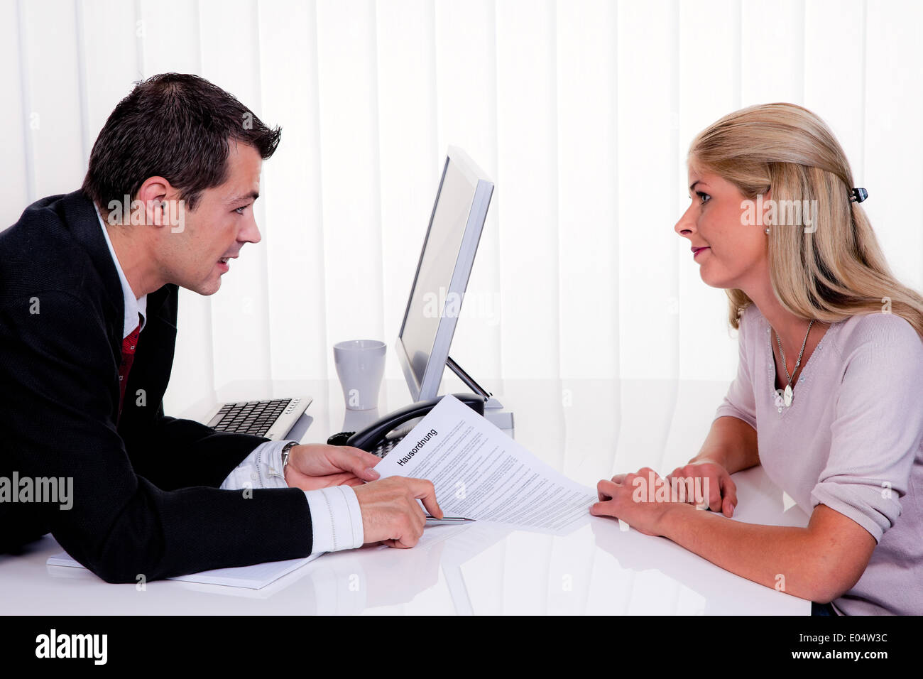 One and woman with a consultation, Mann und Frau bei einem Beratungsgespraech Stock Photo