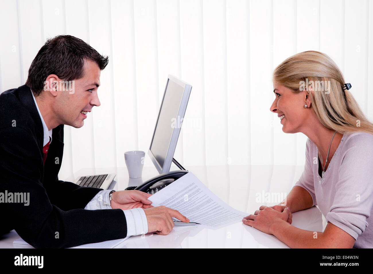 One and woman with a consultation, Mann und Frau bei einem Beratungsgespraech Stock Photo