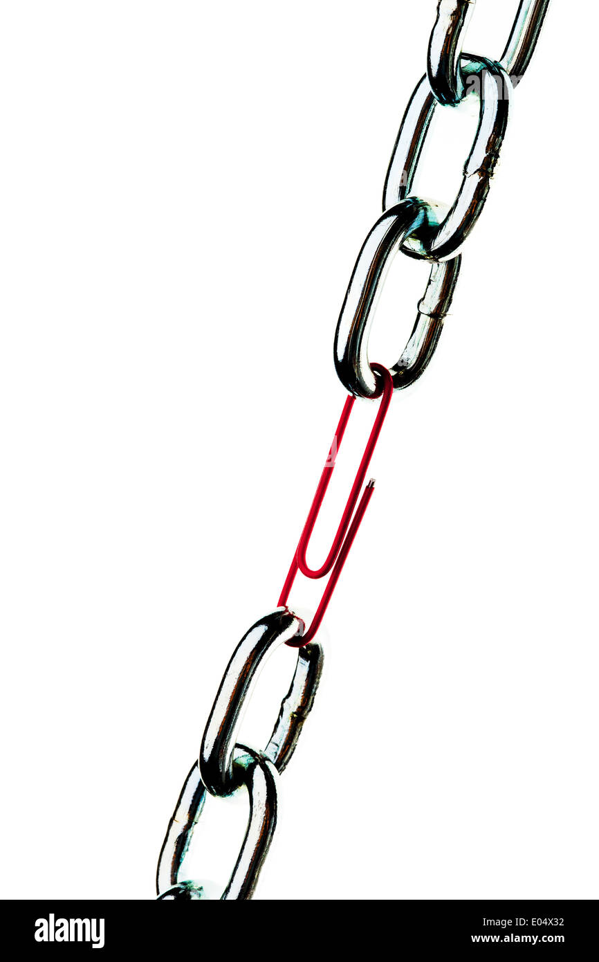 Defective steel chain is held together by a paper clip, Defekte Stahlkette wird von einer Bueroklammer zusammengehalten Stock Photo