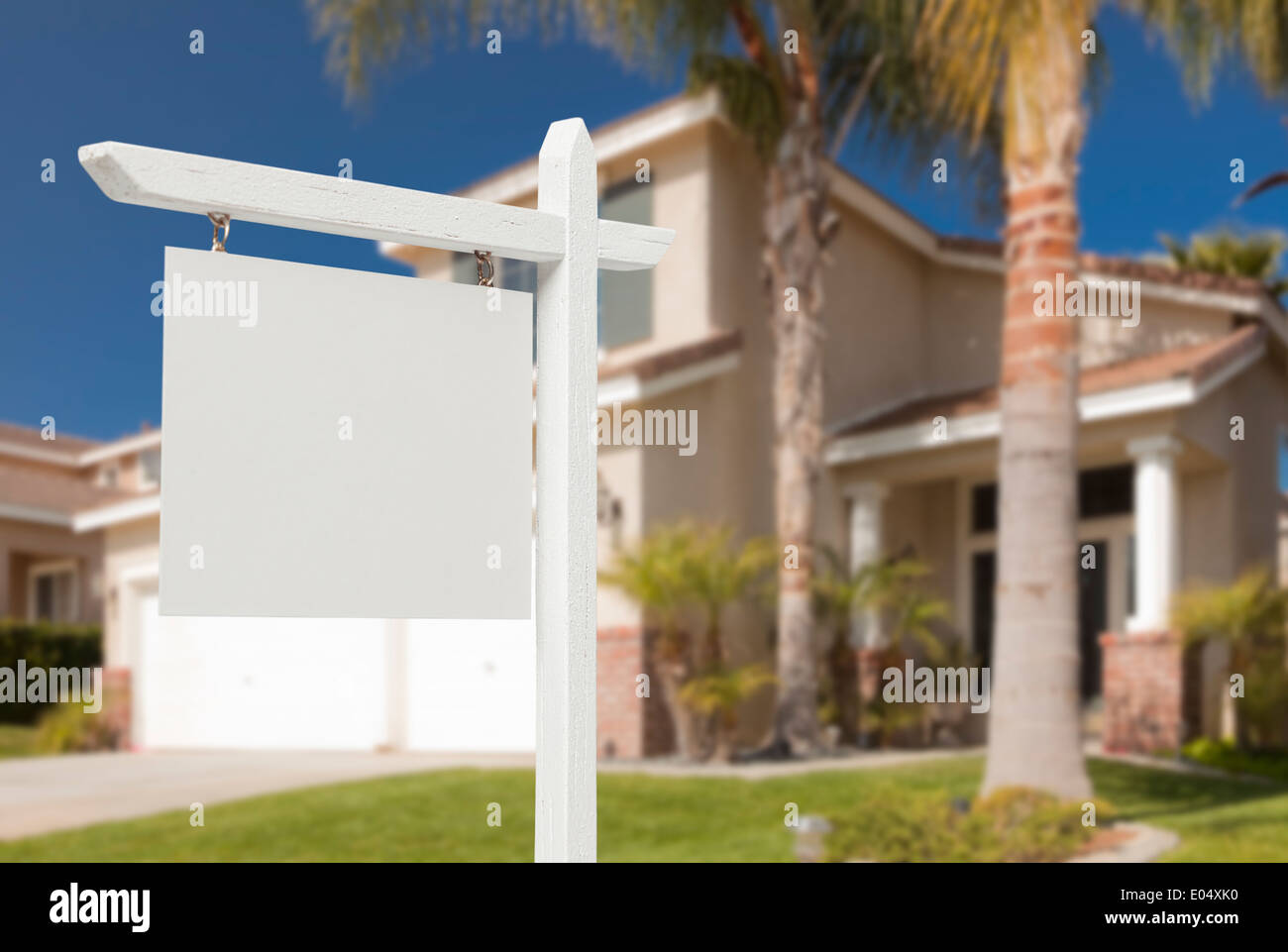 Blank Real Estate Sign in Front of Beautiful New House Stock Photo - Alamy