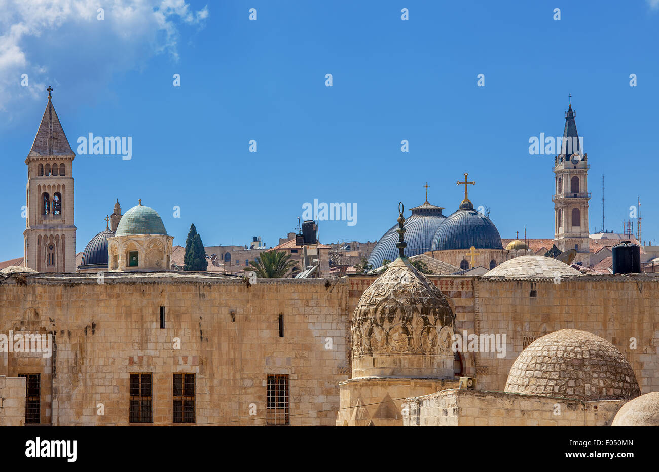 Belfries and domes of christian churches and minarets of mosques under blue sky in Jerusalem, Israel. Stock Photo