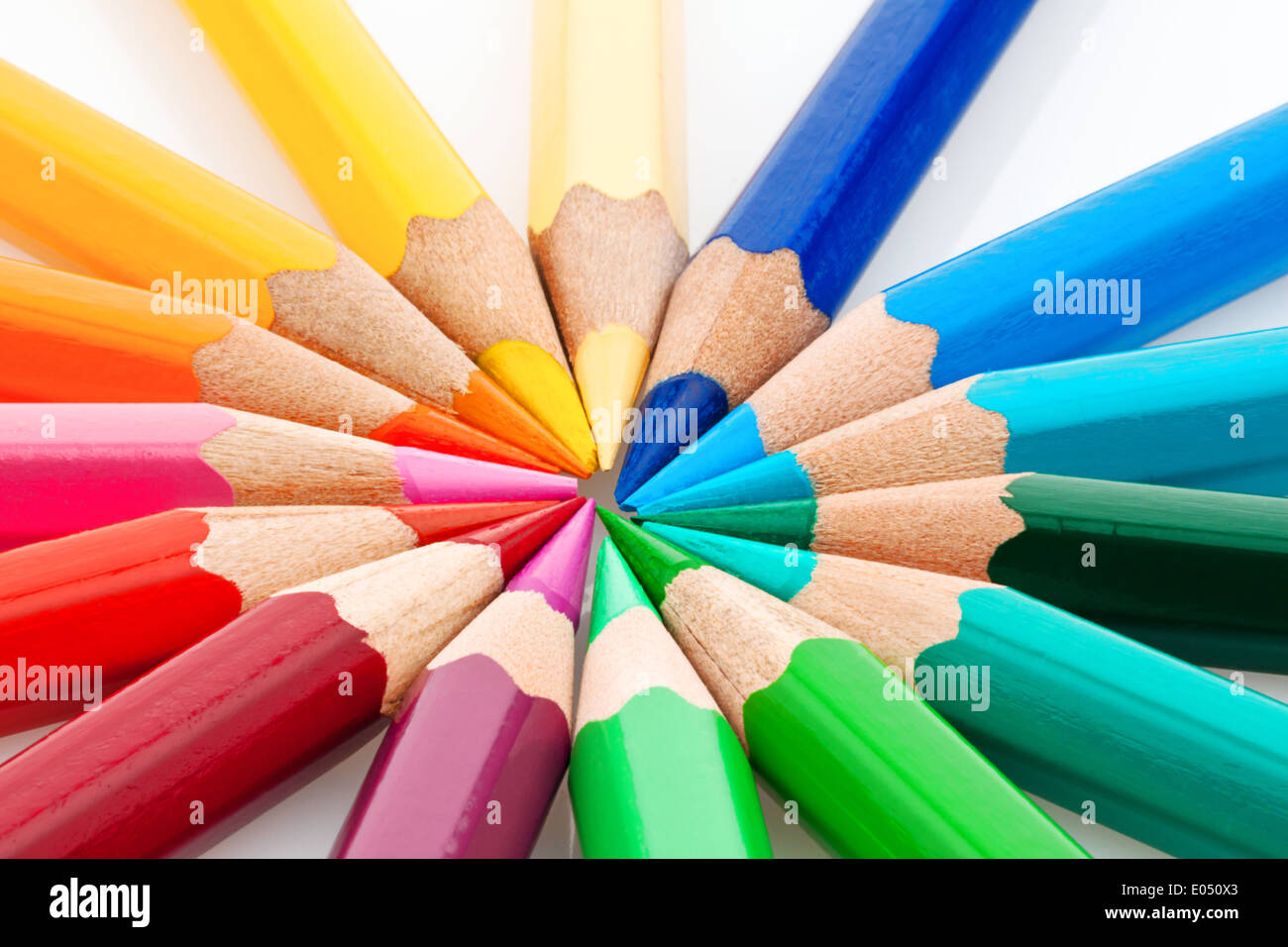 Many different coloured colour pencils on a white background., Viele verschiedene bunte Farbstifte auf einem weissem Hintergrund Stock Photo