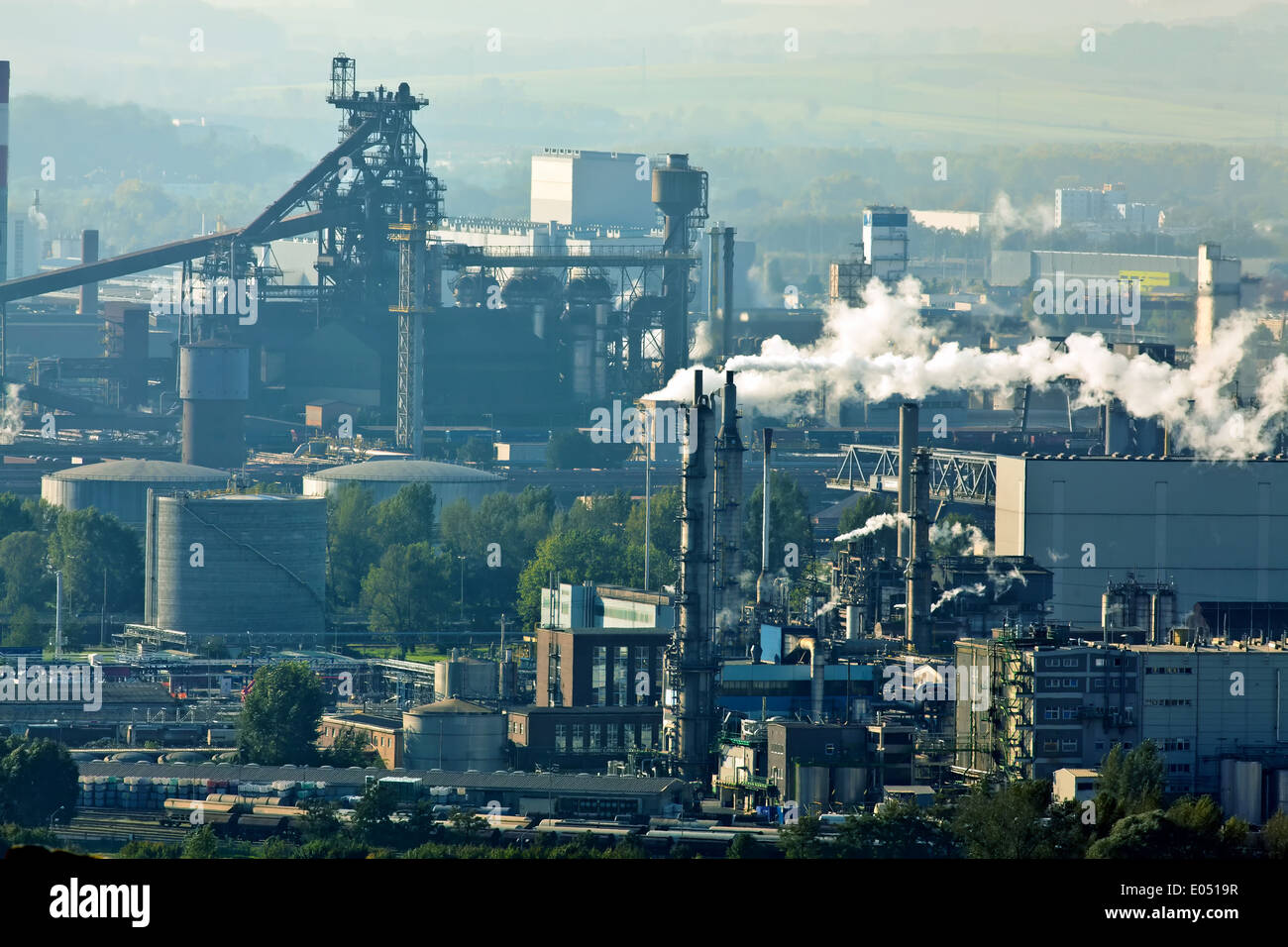 Smoking chimneys in the metal industry. Industry area, Rauchende Schlote in der Metall Industrie. Industrie Gelaende Stock Photo