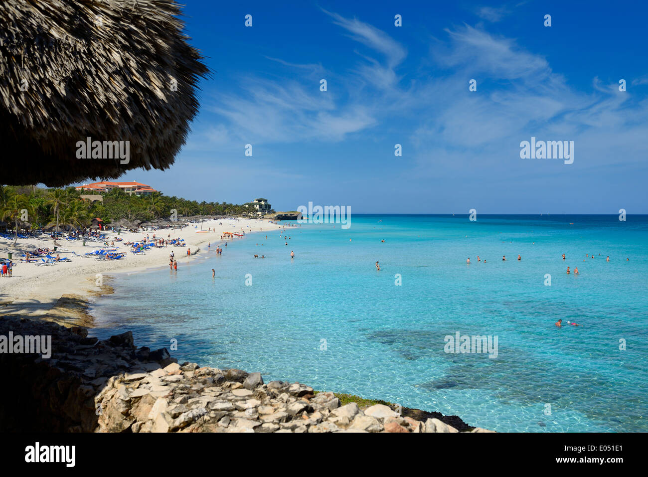 Tourists sunbathing and swimming at white sand beach and turquoise water of the Atlantic ocean of resort at Varadero Cuba Stock Photo