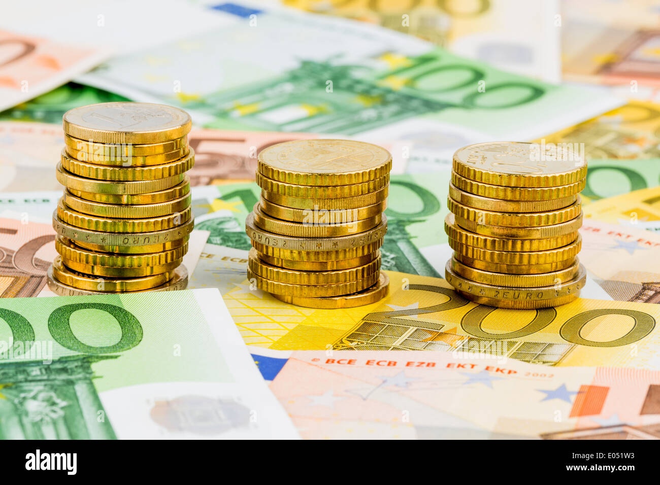 Three piles of monetary coins, symbolic photo for budgetary planning, investment and interest, Drei Stapel Geldmuenzen, Symbolfo Stock Photo