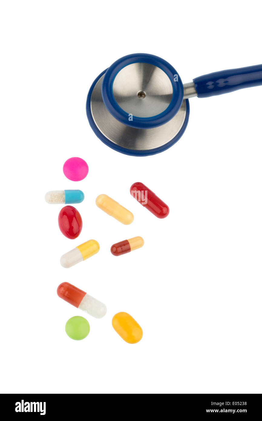 Coloured tablets and a Stethoskop, symbolic photo for diagnostics, heart deseases and interaction, Bunte Tabletten und ein Steth Stock Photo